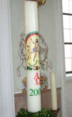 Nude figures on a Paschal candle